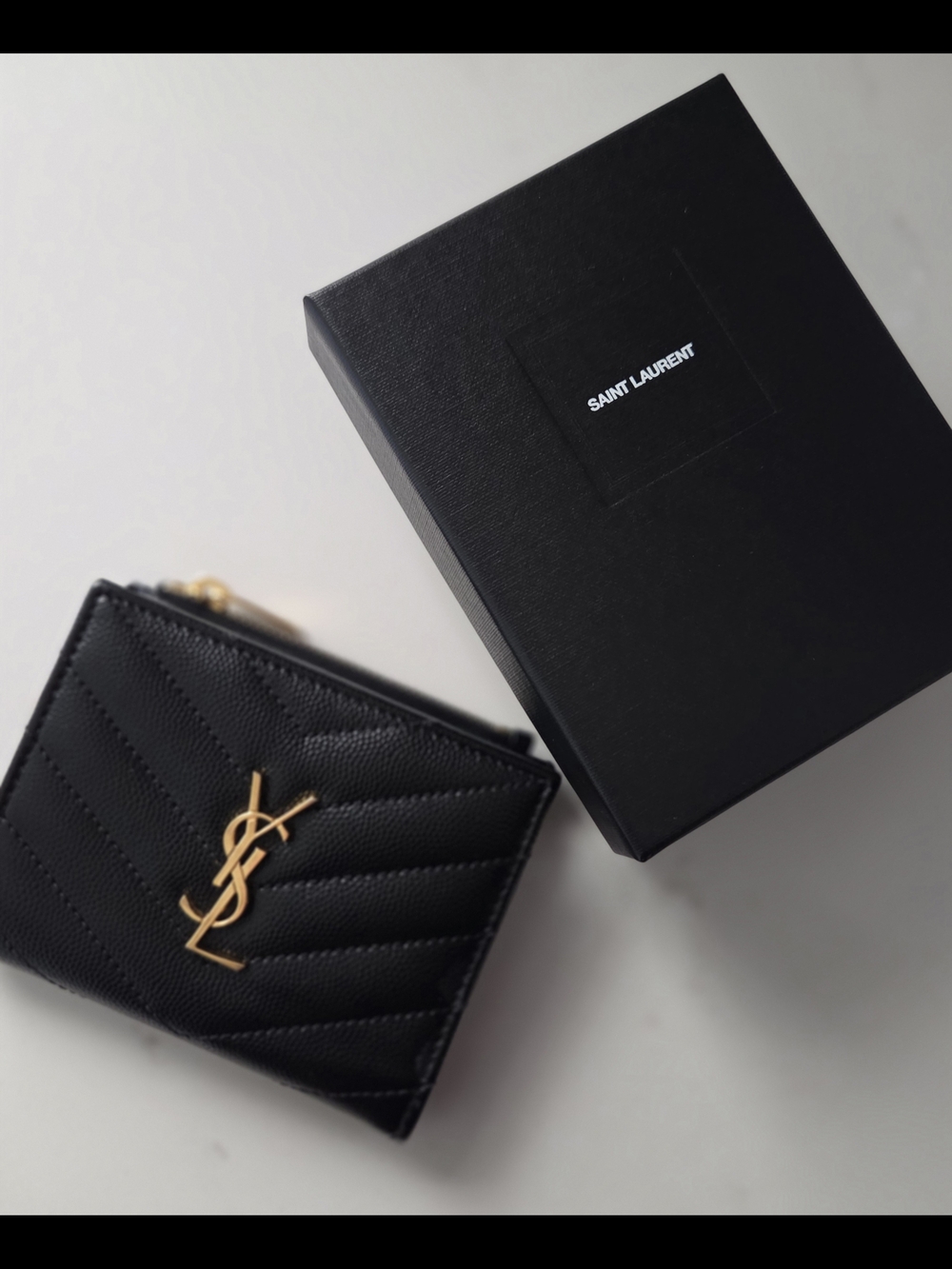 YSL Cassandre bi-fold wallet in grain de poudre leather